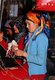 China: A Uighur carpet weaver, carpet factory, Khotan, Xinjiang
